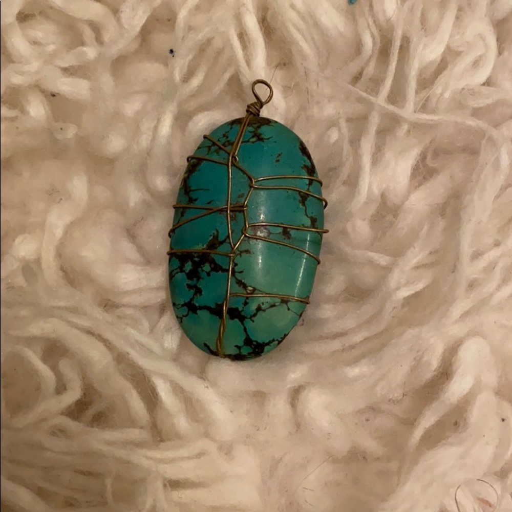 Turquoise stone wrapped in brass